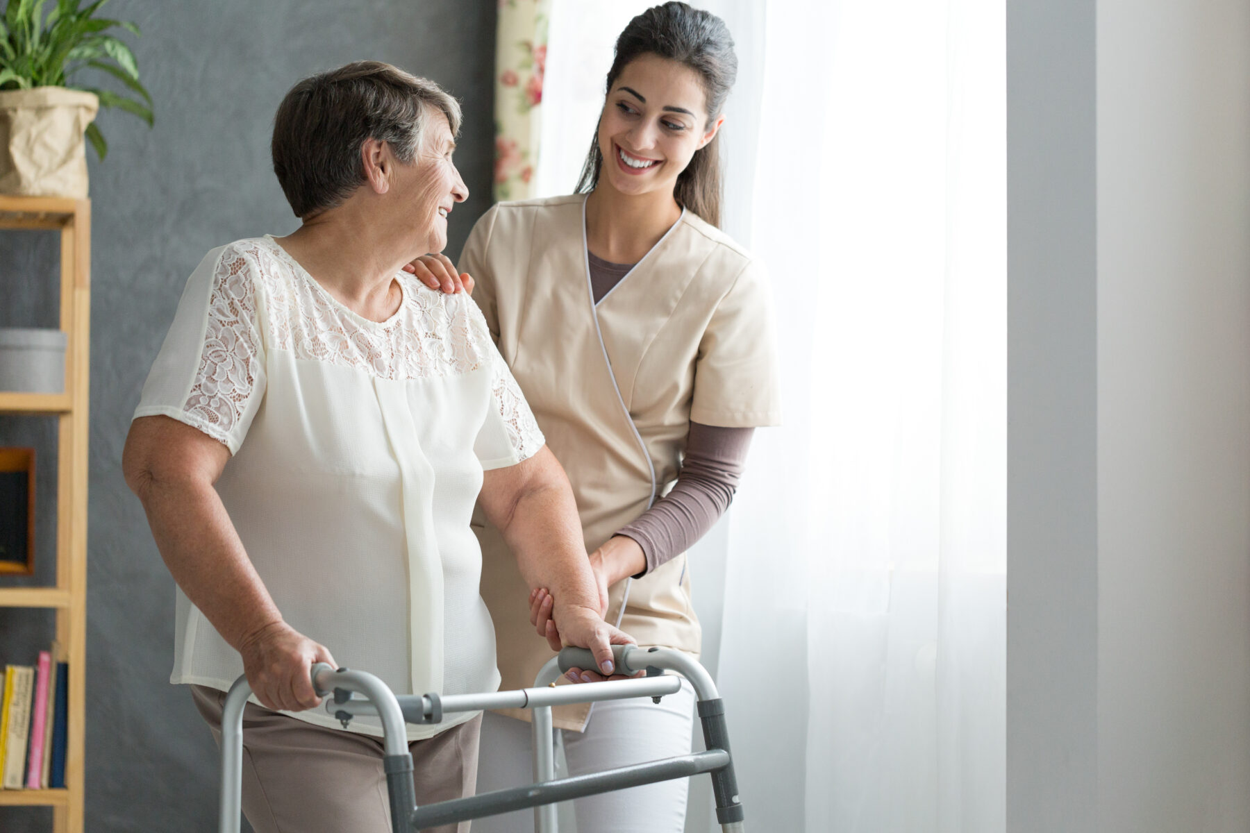 Closing the data gap: Advancing Innovation in Women's Healthcare - a carer supports a woman with mobility challenges 